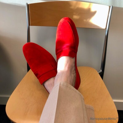 Resting feet on chair, red shoes